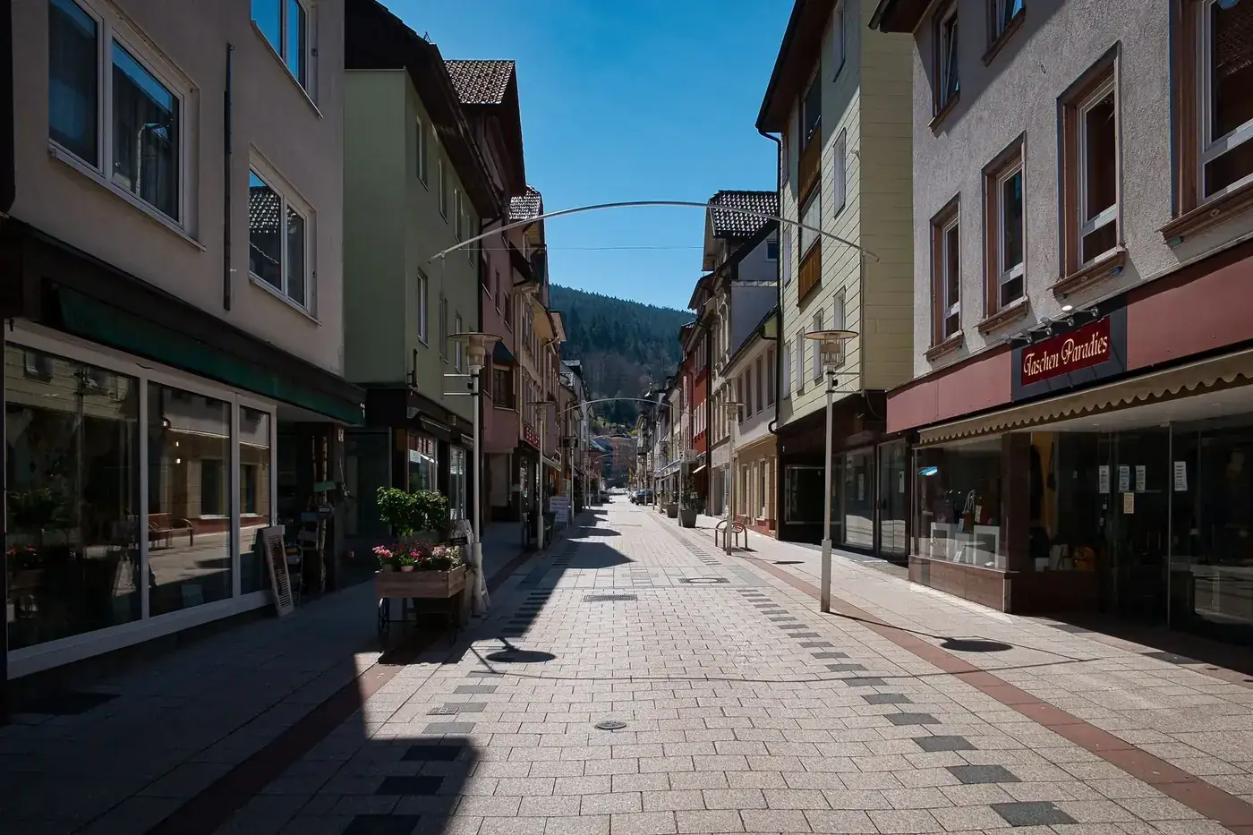 Explore the quaint streets of Bad Wildbad on a sunny day, capturing urban charm.