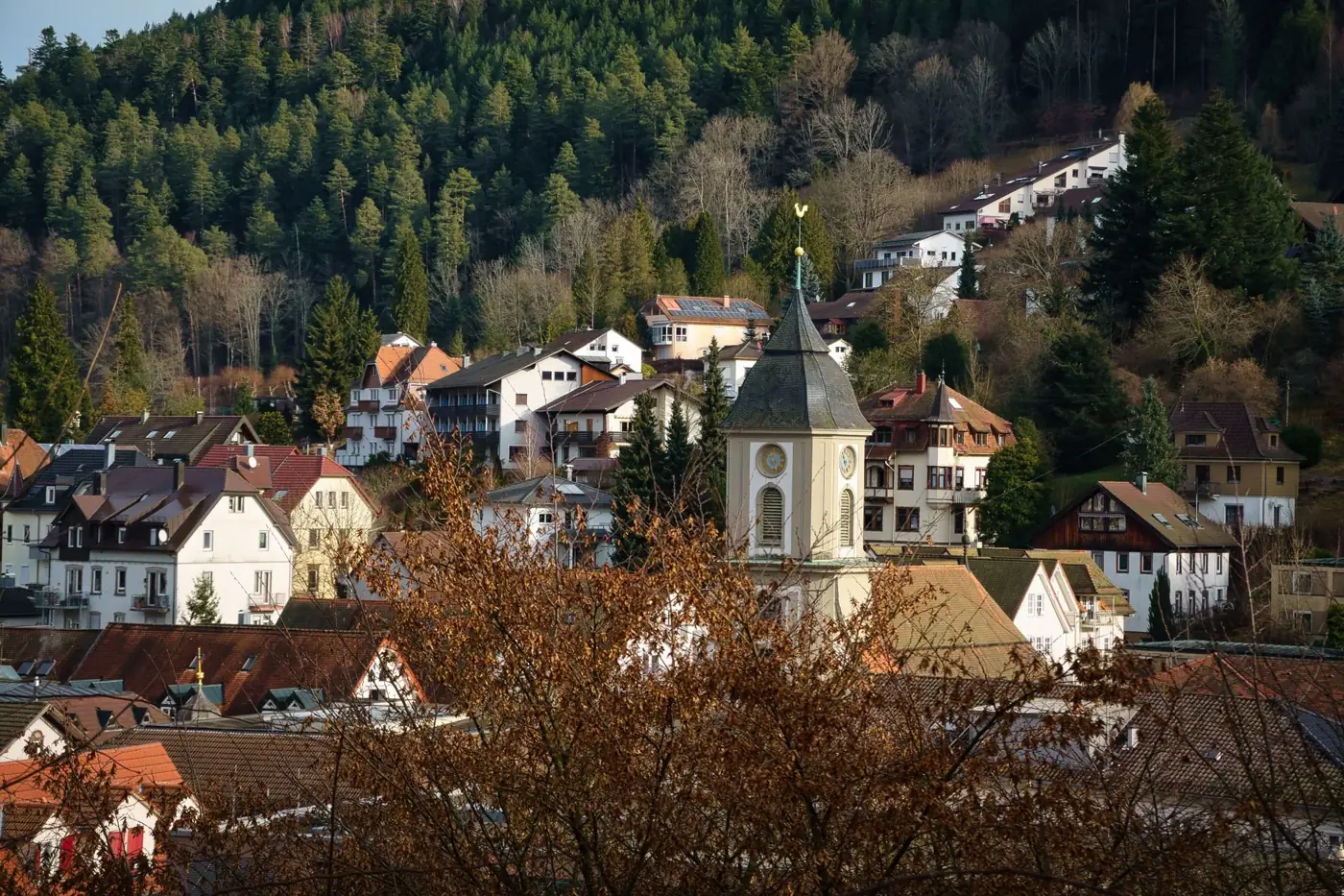 Charming townscape of Bad Wildbad in Germany with lush forest backdrop, showcasing picturesque architecture and landscape.