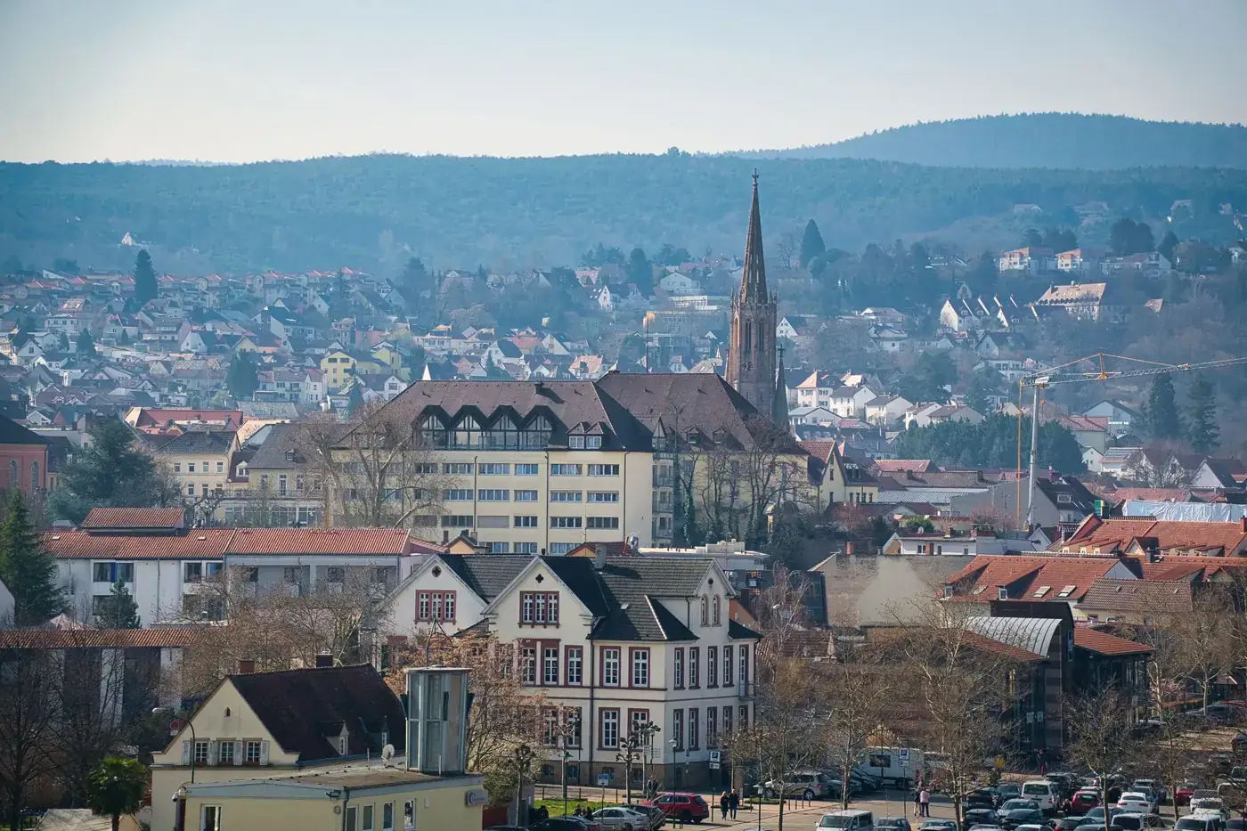 A picturesque view of Bad Dürkheim in Rheinland-Pfalz, showcasing historic architecture with a church and scenic landscape.