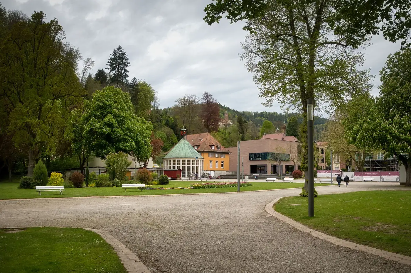 Lush green park in Bad Liebenzell, Germany, featuring historic buildings and serene pathways.