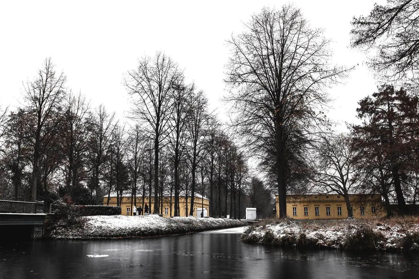 Captivating winter scene of snow-covered park and architecture in Potsdam, Germany.