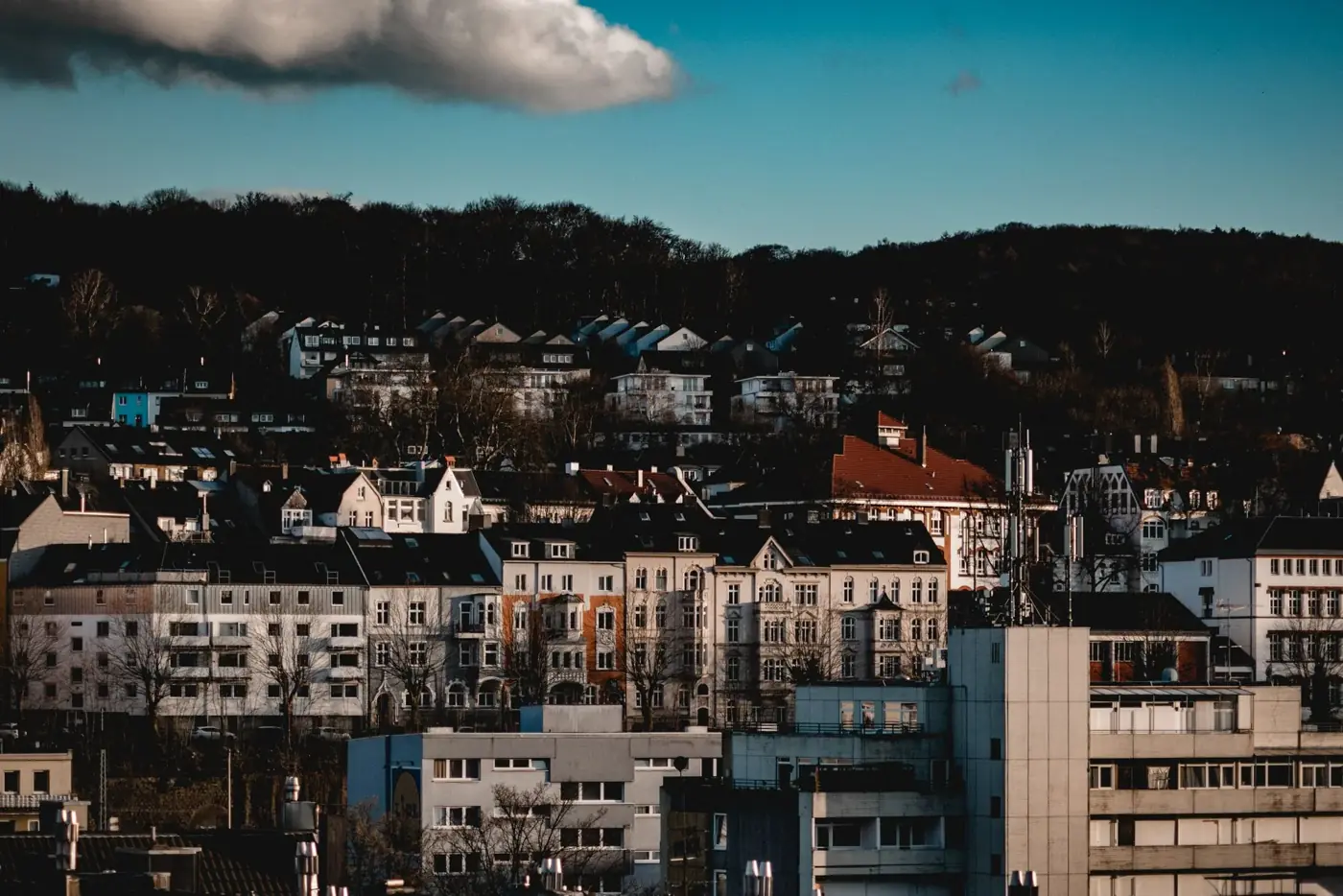 A picturesque view of urban architecture in Wuppertal, Germany, under a vibrant sky.