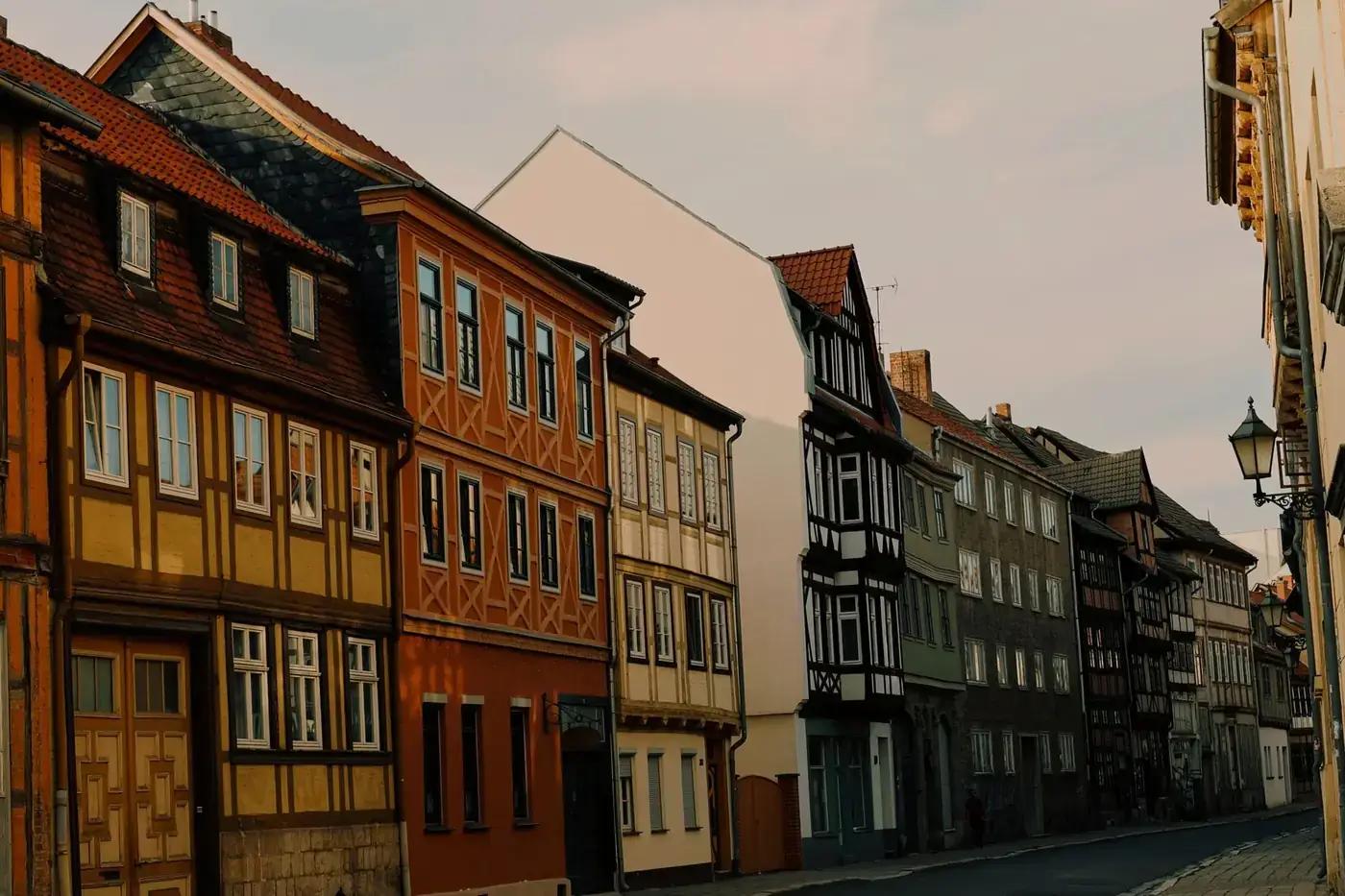 Quaint street view of half-timbered houses in historic Quedlinburg, Germany.