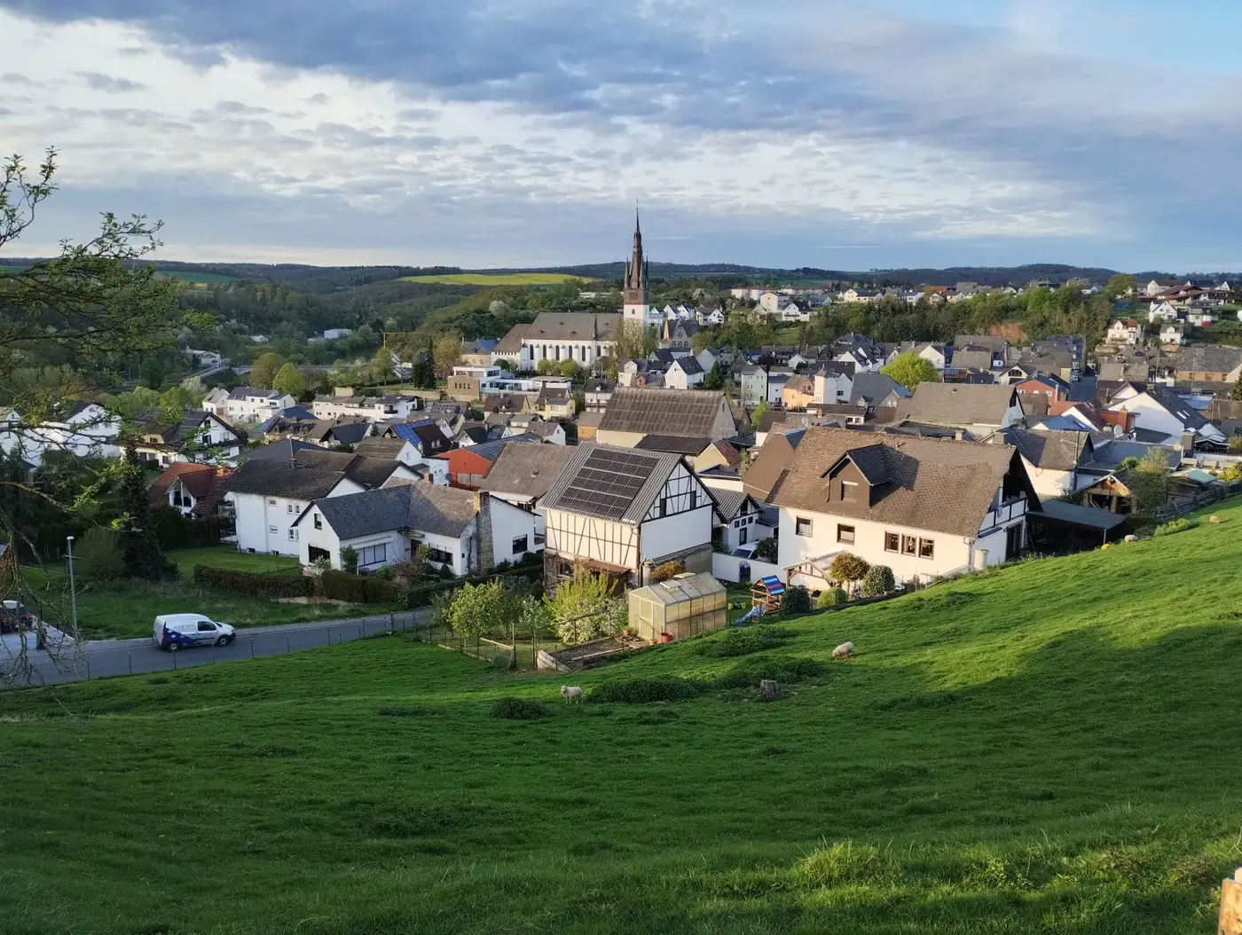 Picturesque view of Villmar, Germany showcasing charming houses and church on a lush hillside.