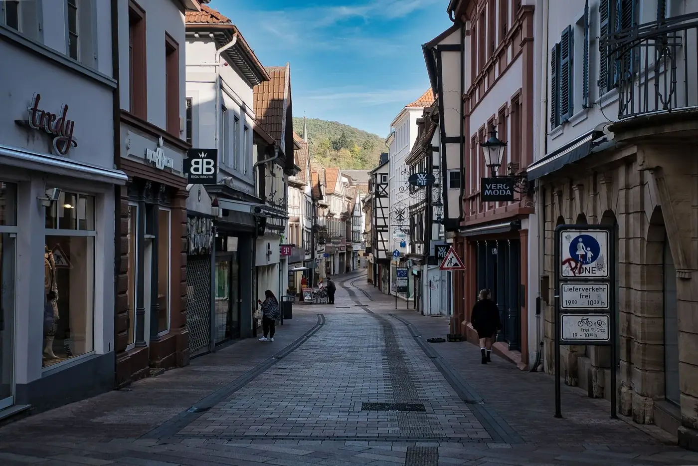 Picturesque street view in Neustadt, Germany, featuring quaint shops and historic architecture.