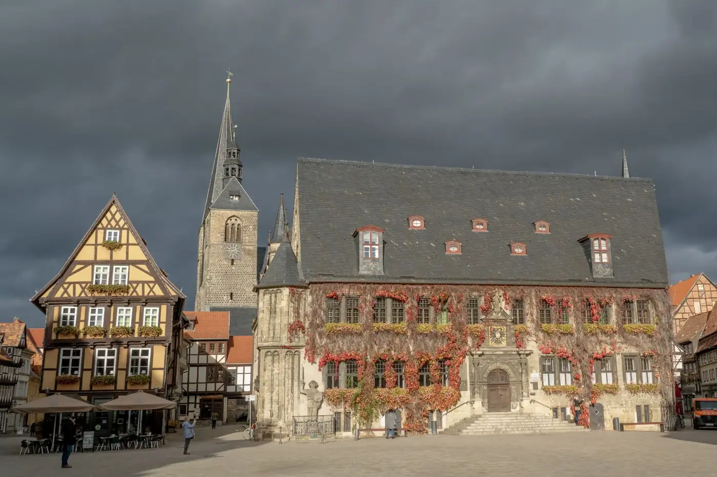 Scenic view of Quedlinburg's historic Rathaus with autumn foliage in Germany.