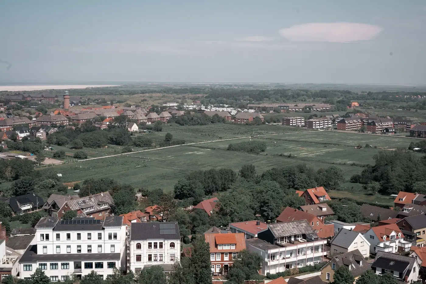 Aerial view of Borkum, Germany highlighting residential and green areas in a tranquil setting.