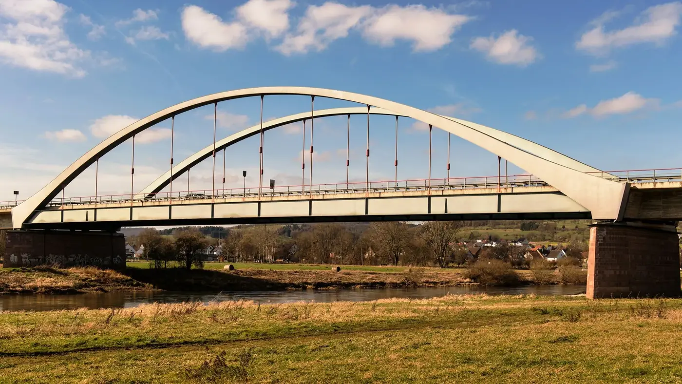 Beautiful modern arch bridge spanning the scenic landscape in Holzminden, Germany.