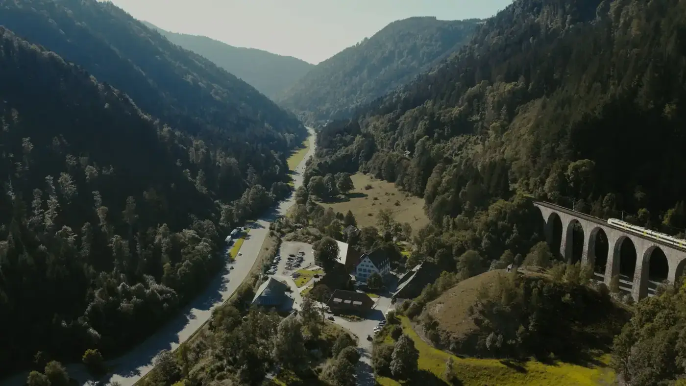 Aerial shot of a historic railway bridge in the scenic valley of Breitnau, Germany.