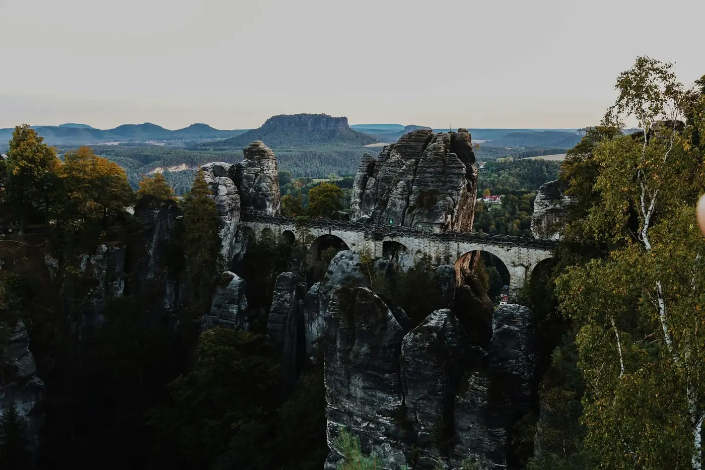 Explore the breathtaking Bastei Bridge amidst the Elbe Sandstone Mountains. Perfect travel inspiration.