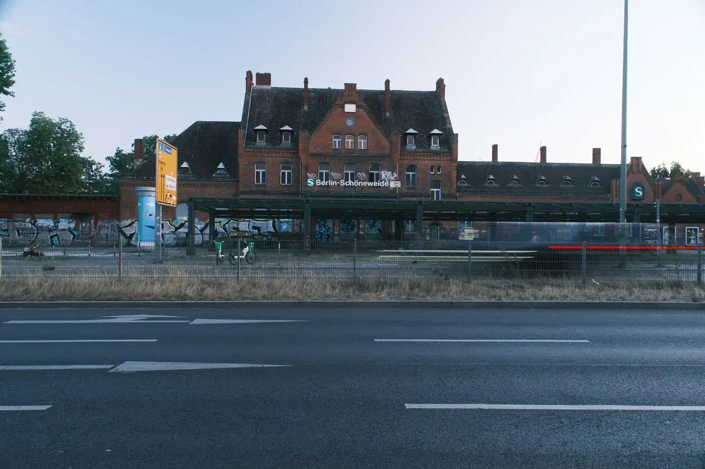 Historic brick architecture of Berlin Schöneweide train station during daylight.