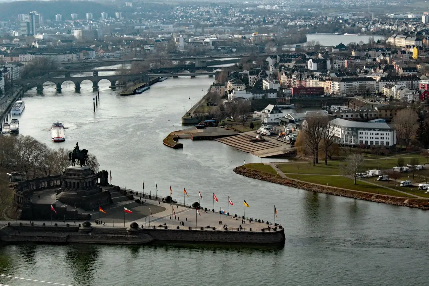 Aerial view of the Deutsches Eck monument in Koblenz with converging rivers, an iconic cityscape.