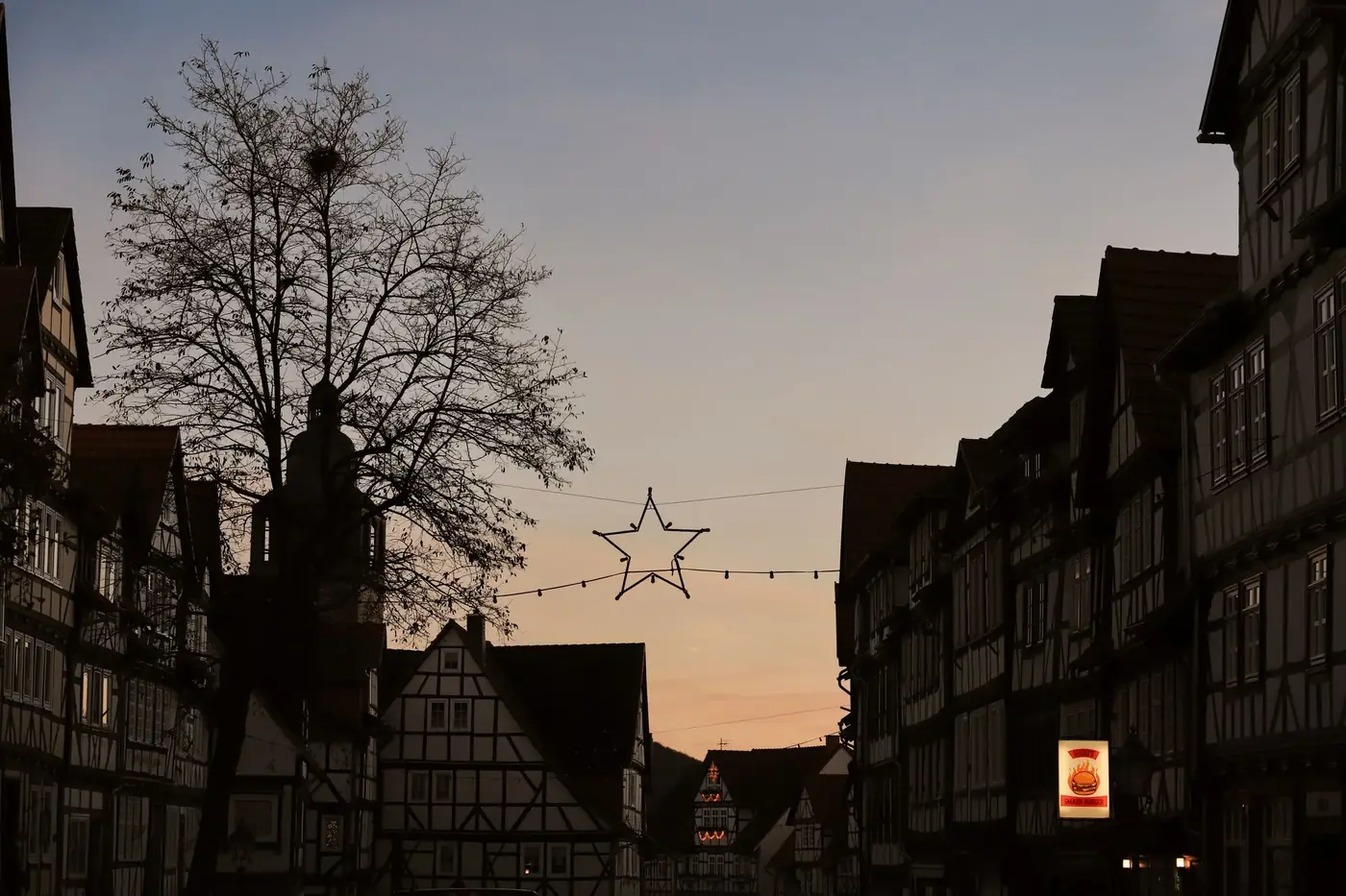 Enchanting twilight scene in Bad Sooden-Allendorf with festive lights and historic buildings.